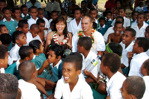 Kelly Hu and Kelly Slater at a Fiji Schoolhouse